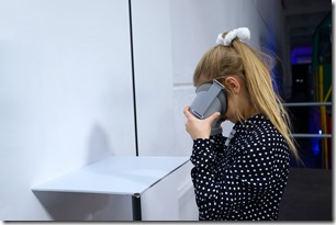 Girl in the 3D glasses watching pictures