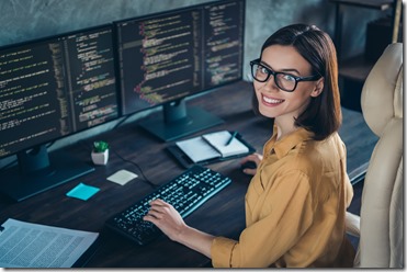 Profile side view portrait of attractive cheerful skilled girl geek developing web site cyber security at workplace workstation indoors