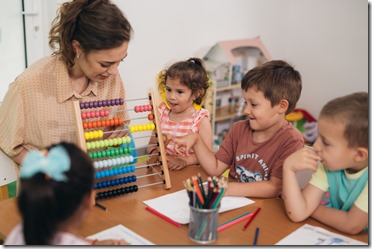 teacher teaching children in daycare