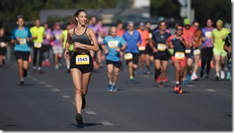 Sportswoman run marathon. Female person jog. Female athlete Girl runner champion