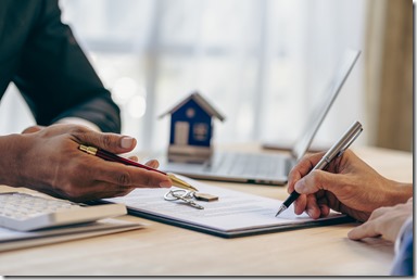 Loan officers recommend homes to clients after signing a real estate contract with an approved mortgage request regarding the offer of mortgage interest rates and home insurance.