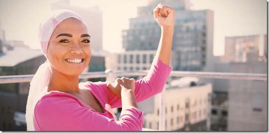 Strong woman in city with breast cancer awareness