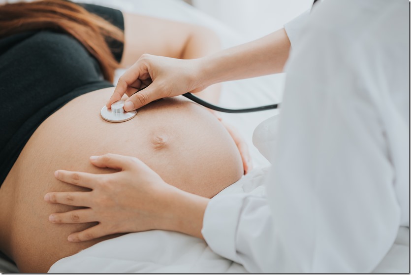 doctor use stethoscope to check baby heartbeat