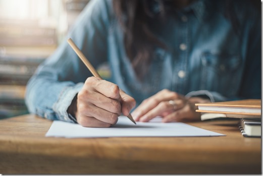 high school,university student study.hands holding pencil writing paper answer sheet.sitting lecture chair taking final exam attending in examination classroom.concept scholarship for education abroad