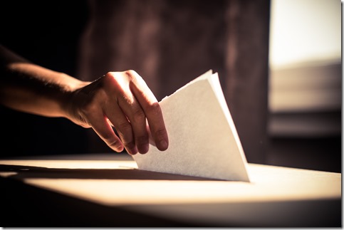 Conceptual image of a person voting during elections